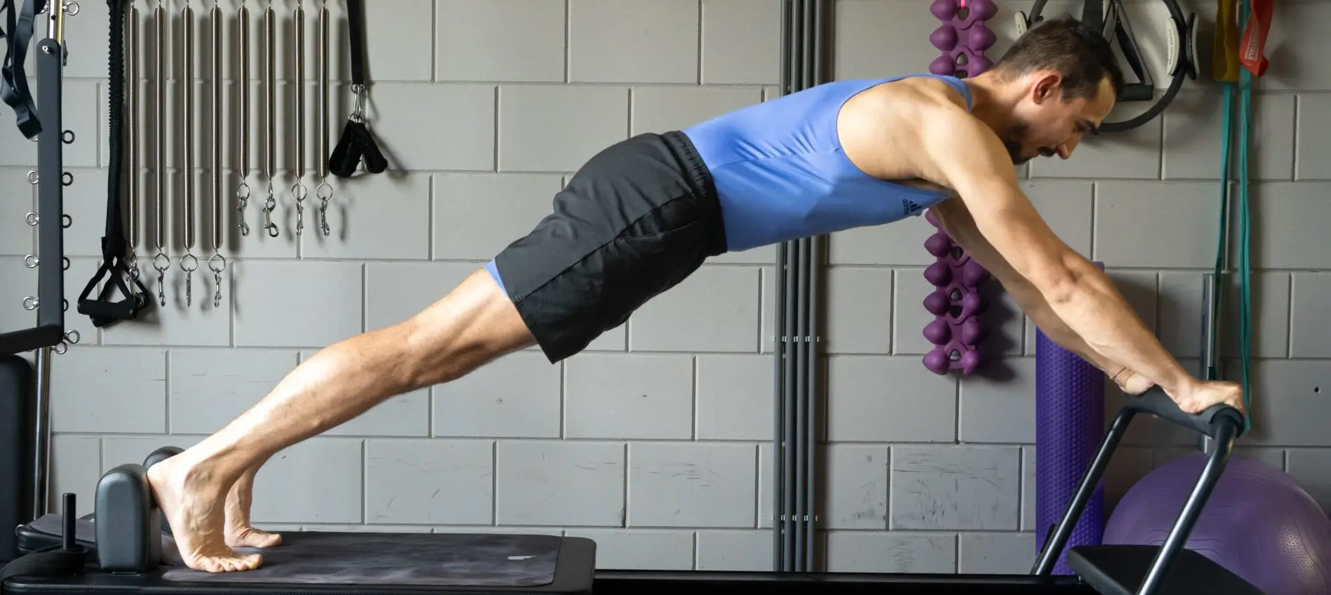 Lorenzo performing Long Stretch on the Reformer
